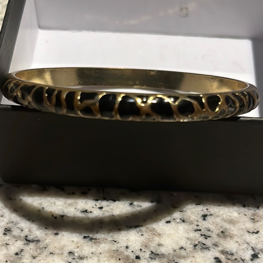 Animal Print Bangle Black and brass colored.